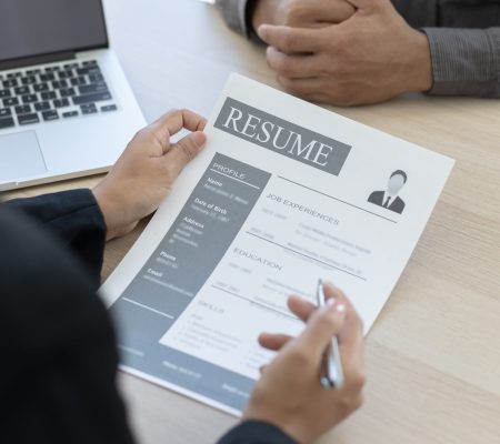 Employer or HR department is reading the resume and interviewing the ability of new employees, Employer is selecting job applicants, Employment and Recruitment Concept.